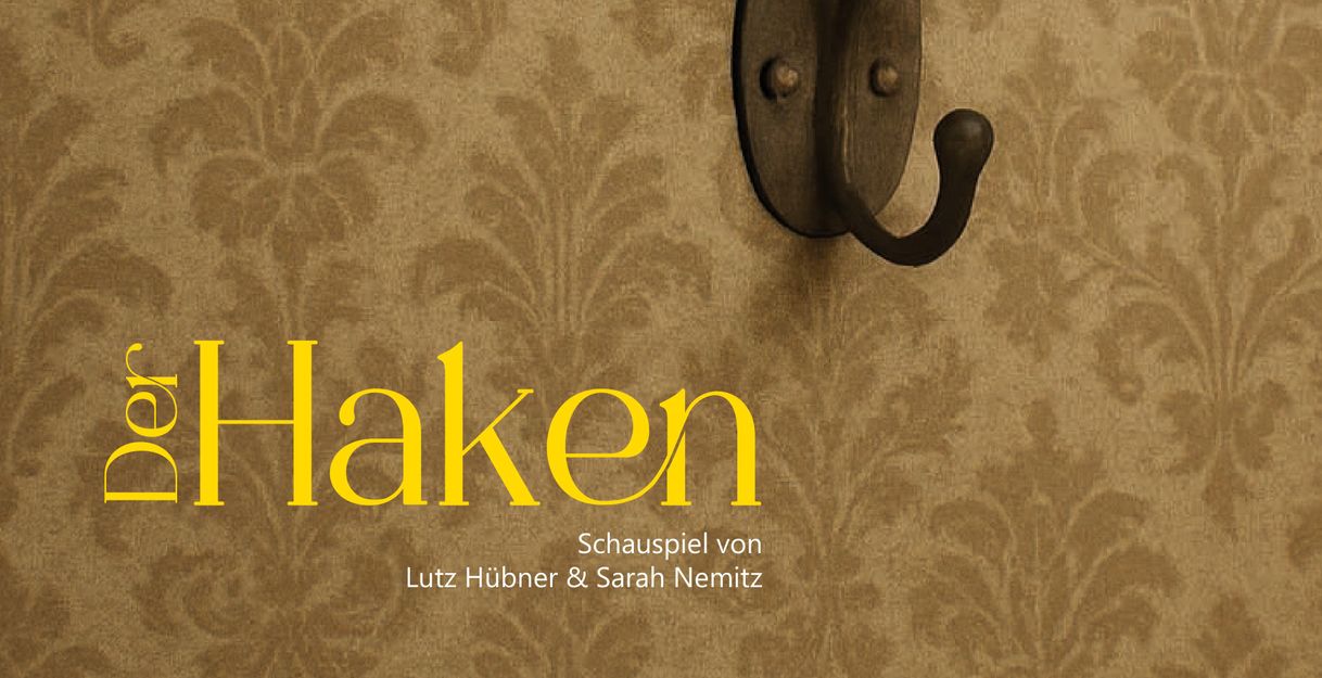 Auf dem Bild ist ein Kleiderhaken, welcher symbolisch für den Titel unseres Theaterstückes 'Der Haken' von Lutz Hübner und Sarah Nemitz steht.